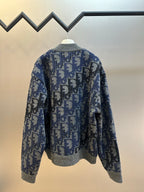 Logo knit zip jacket, blue and gray, back view with full zipper