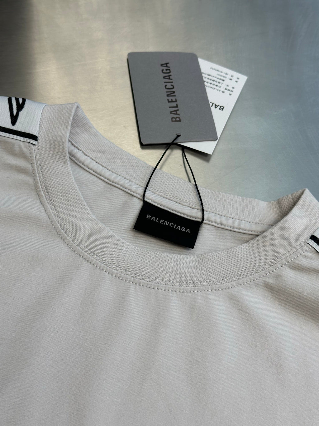 White crewneck T-shirt collar with Balenciaga tags