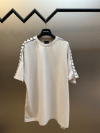 White crewneck T-shirt with short sleeves and Balenciaga logo stripe accents