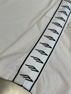 White sleeve panel with black Balenciaga logo graphic trim