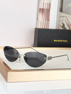 Balenciaga sunglasses with dark lenses and silver frame, round aviator shape