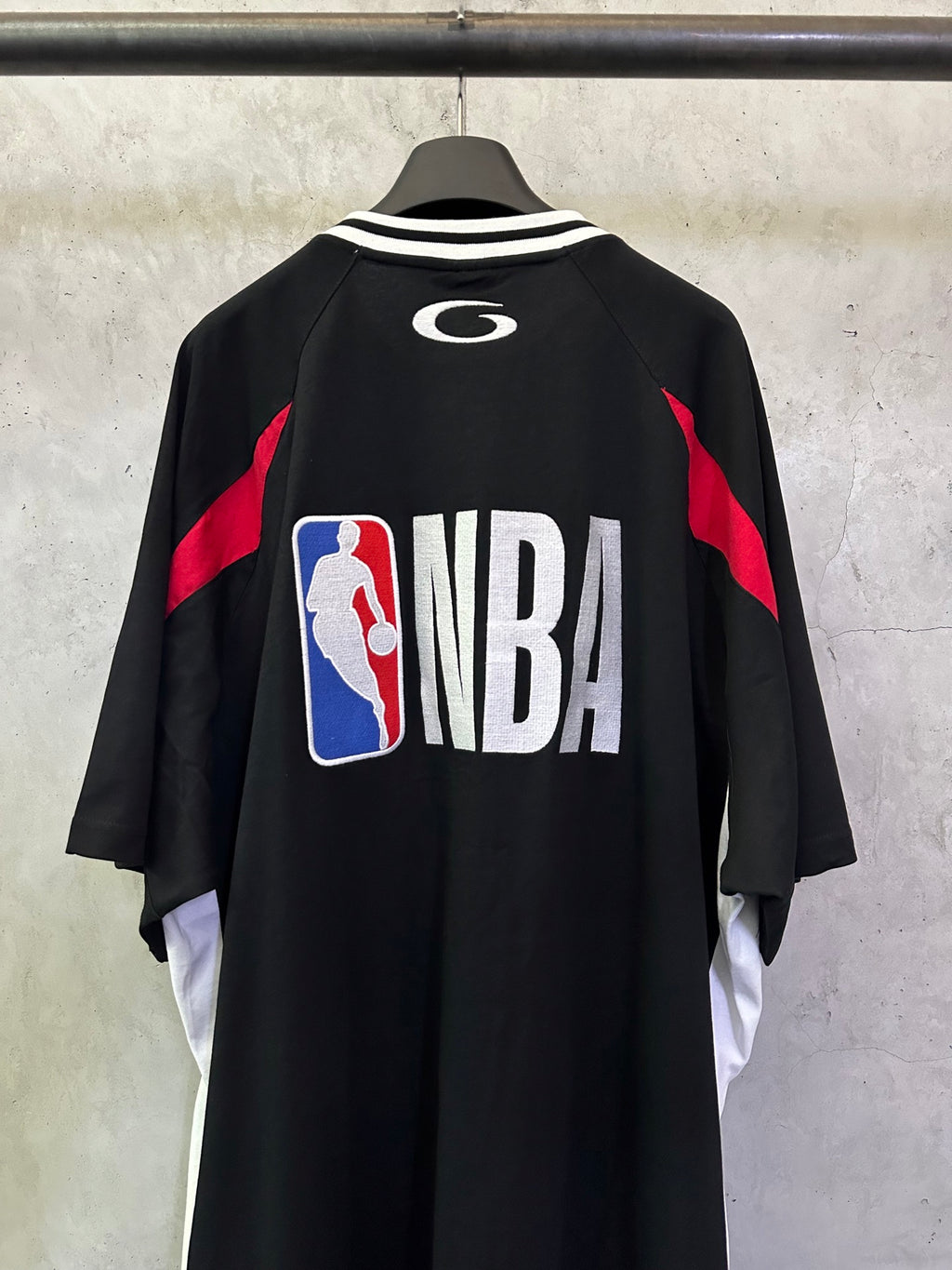 Balenciaga short-sleeve jersey back view with large NBA logo print and red side panels