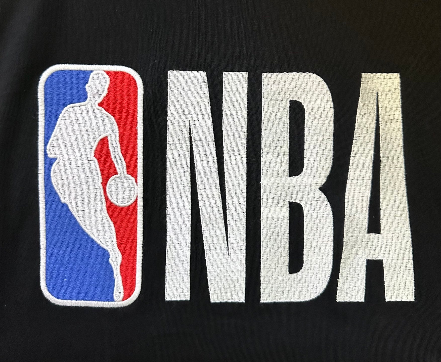 NBA basketball graphic on Balenciaga jersey front, with blue red panel and large lettering