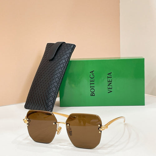Bottega Veneta sunglasses with gold-tone frame and brown tinted lenses