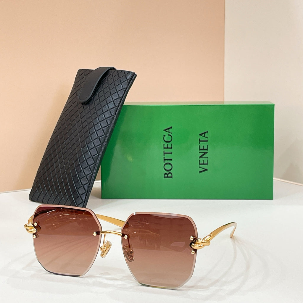 Bottega Veneta sunglasses with gold-tone frame and reddish-brown tinted lenses