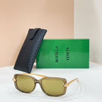 Square sunglasses with light tan frame and yellow-tinted lenses, gold-tone details