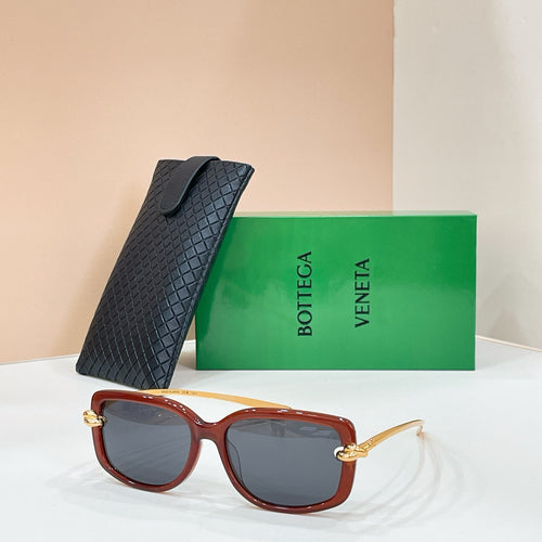 Square sunglasses with dark maroon frame and dark gray lenses, gold-tone details