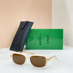 Square sunglasses with white frame and dark brown lenses, gold-tone temple details