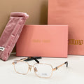 MiuMiu gold-tone rectangular eyeglasses with clear lenses and black top-bar detail