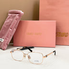 MiuMiu gold-tone rectangular eyeglasses with clear lenses and black top-bar detail