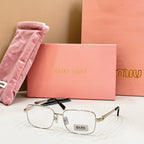 MiuMiu gold-tone rectangular eyeglasses with clear lenses and black accent across bridge