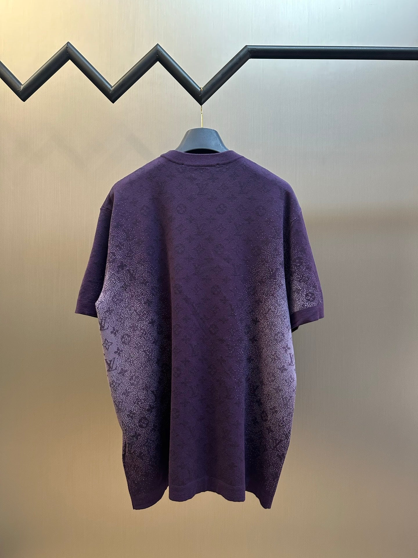 Purple short-sleeve crewneck T-shirt with textured graphic print, back view