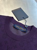 Purple crewneck T-shirt neckline with brand label and hanging tag