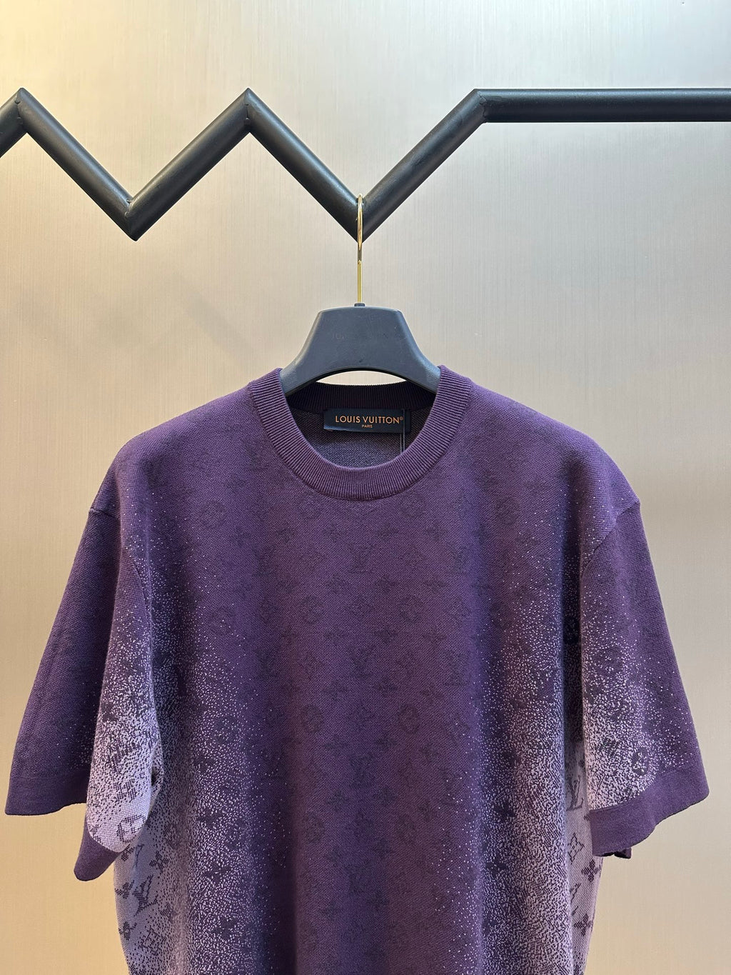Purple short-sleeve crewneck T-shirt with allover textured graphic print, front close-up