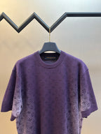 Purple short-sleeve crewneck T-shirt with allover textured graphic print, front close-up