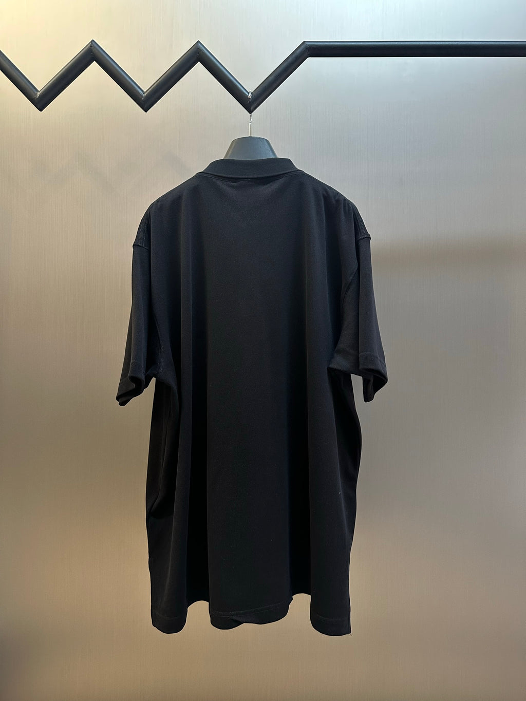 Balenciaga dark polo shirt, short sleeves, back view