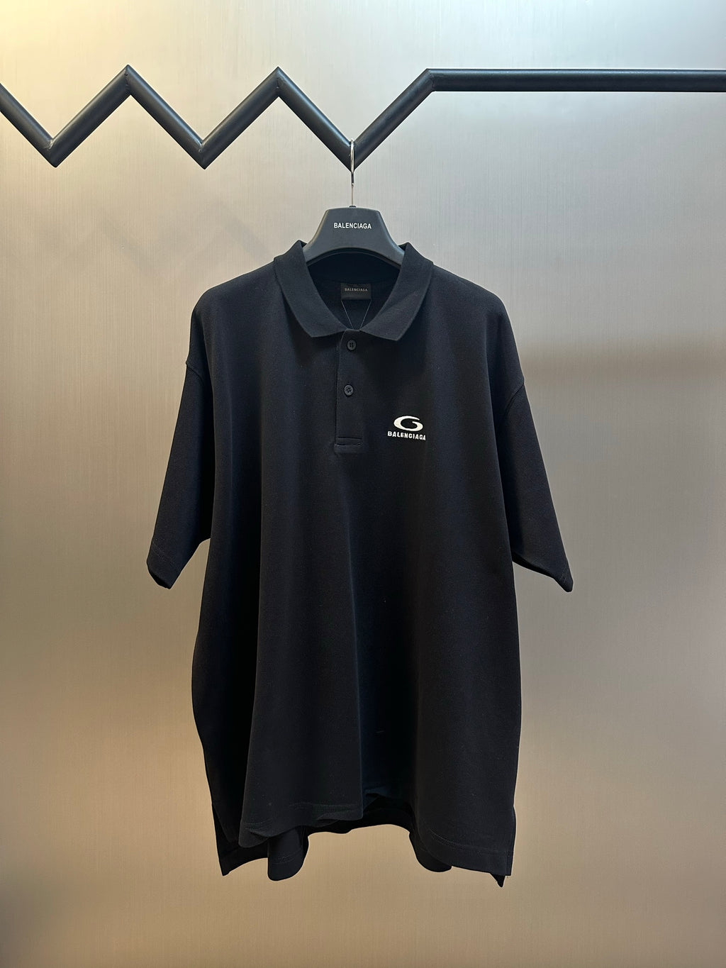 Balenciaga dark polo shirt with logo on chest, short sleeves, button placket