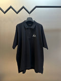 Balenciaga dark polo shirt with logo on chest, short sleeves, button placket