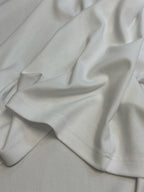 Louis Vuitton white T-shirt fabric close-up with stitched hem