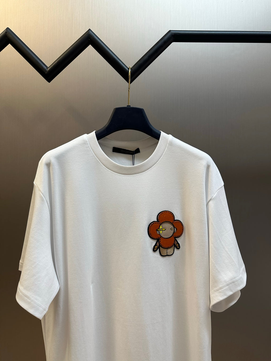 Louis Vuitton white T-shirt with orange bear appliqué on front