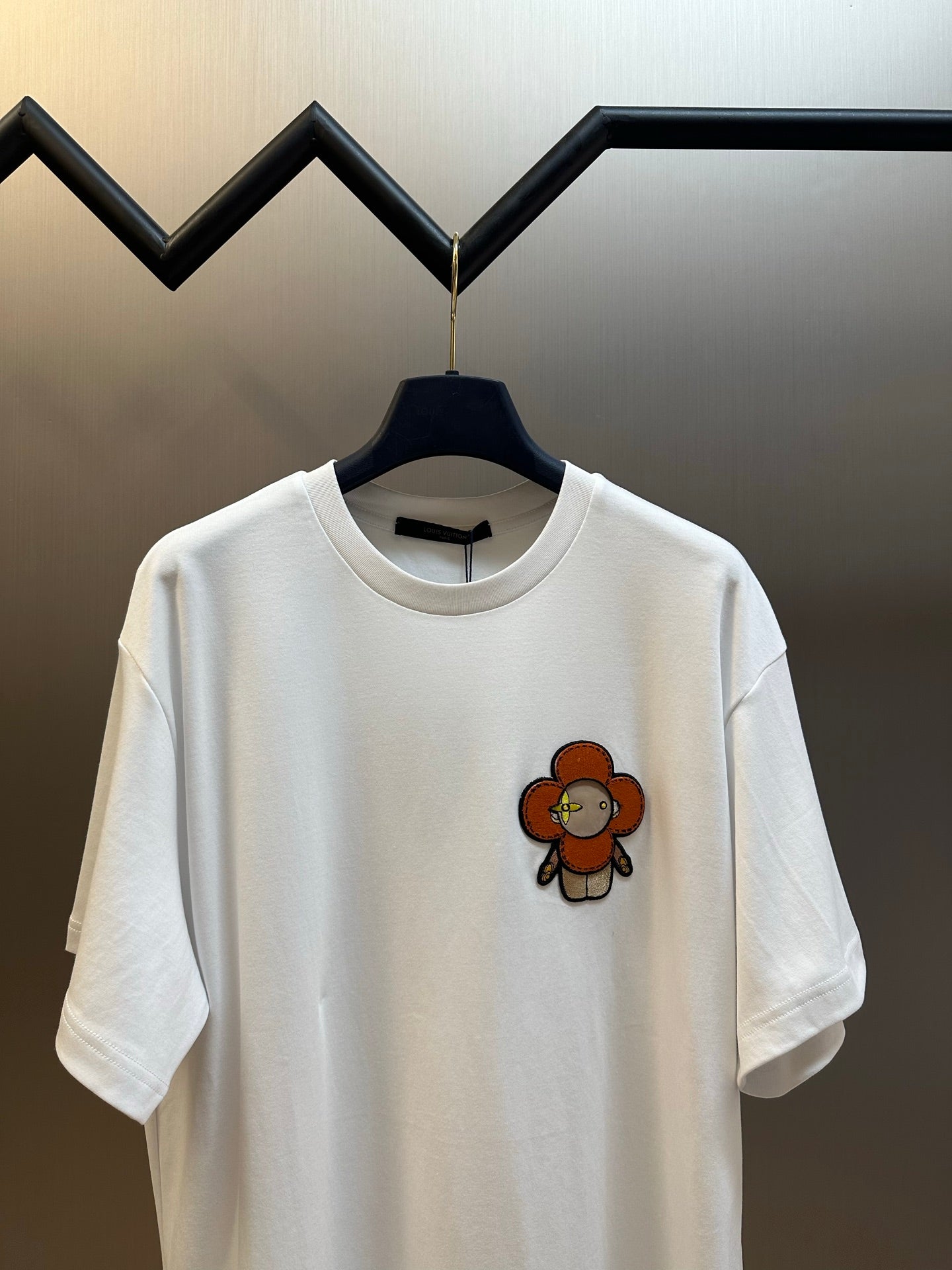 Louis Vuitton white T-shirt with orange bear appliqué on front
