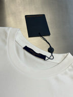 White T-shirt collar with cord tag and interior brand label