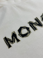 White T-shirt with large black embroidered MONCLER lettering