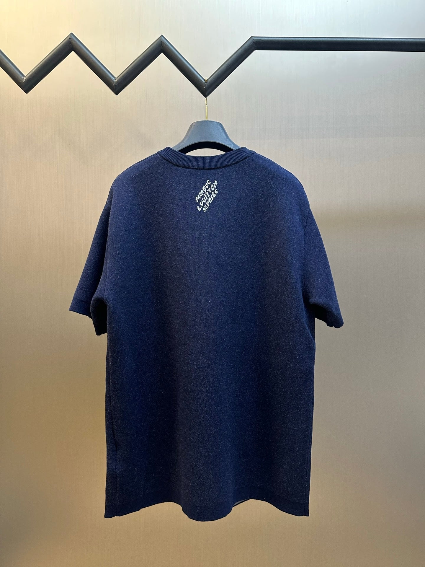 Navy crewneck T-shirt back with small centered white logo print