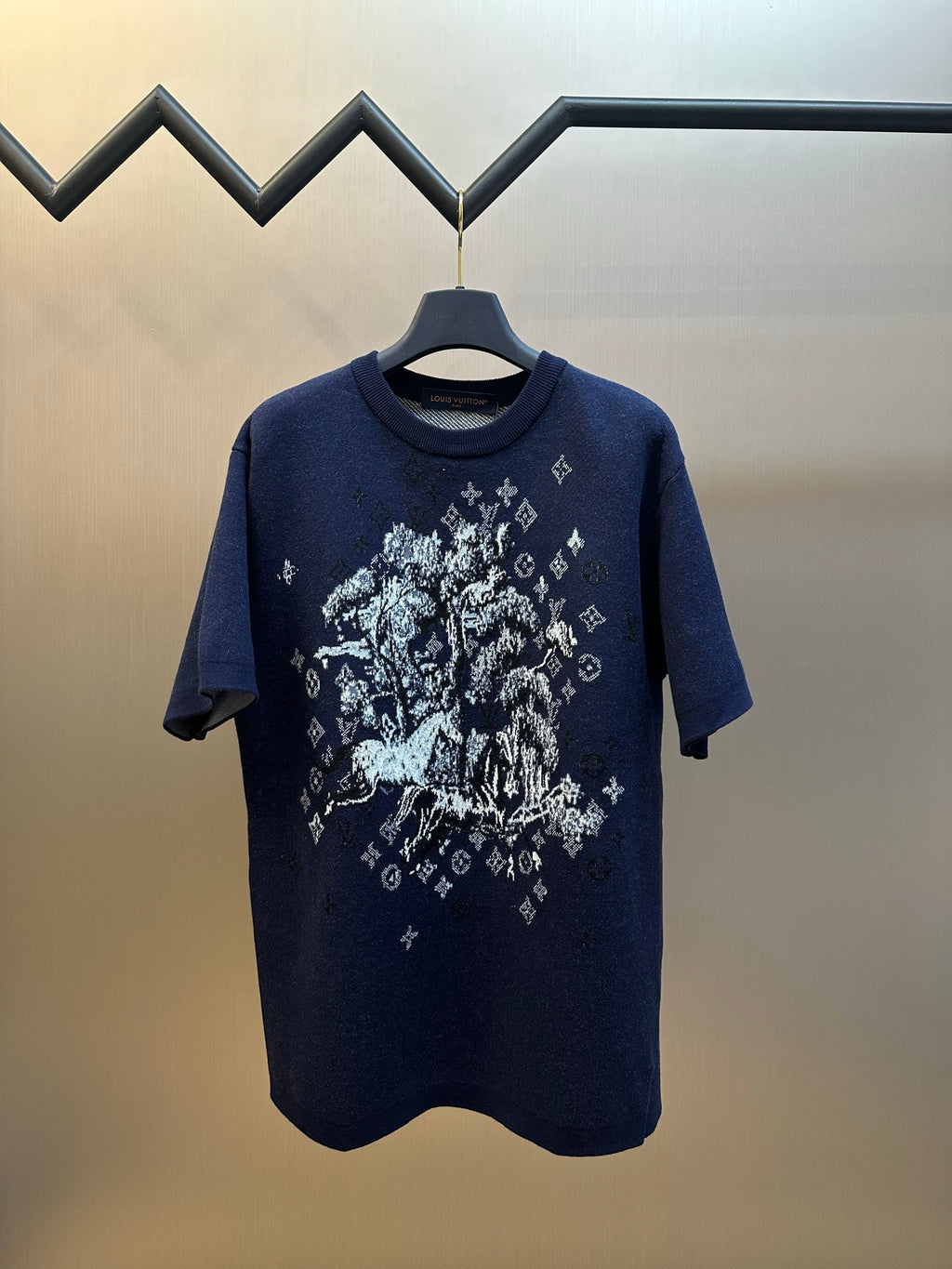 Navy short-sleeve T-shirt with large white graphic on front