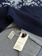 Navy T-shirt inside collar with woven tag and hanging label