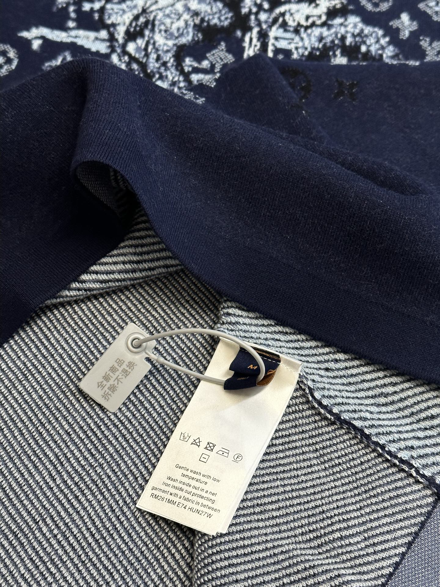 Navy T-shirt inside collar with woven tag and hanging label
