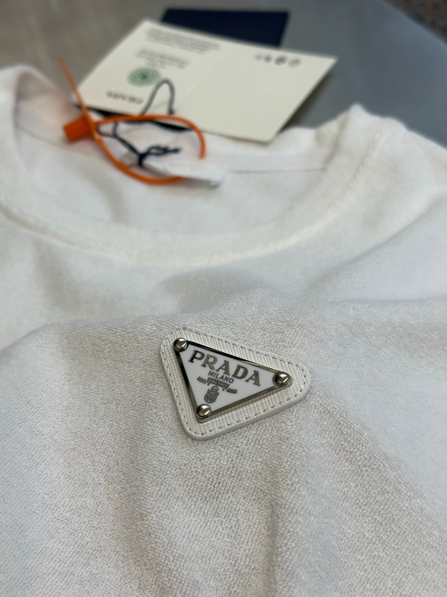 Prada T-shirt with triangular logo patch and crew neck tags