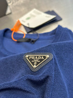 Blue short-sleeve T-shirt with Prada triangle patch and hanging tag