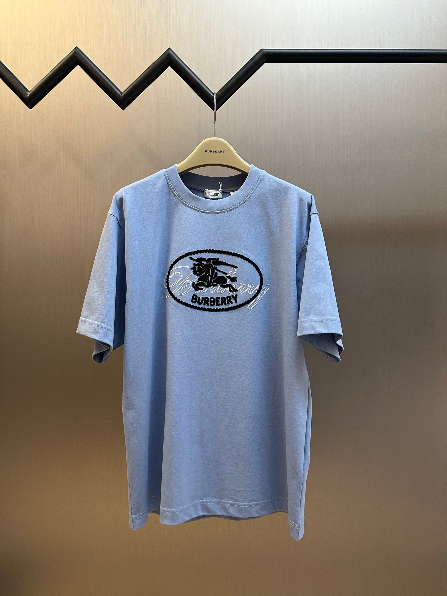 Light blue Burberry short-sleeve T-shirt with oval horse logo at chest