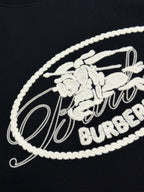 White embroidered Burberry oval crest logo on black T-shirt