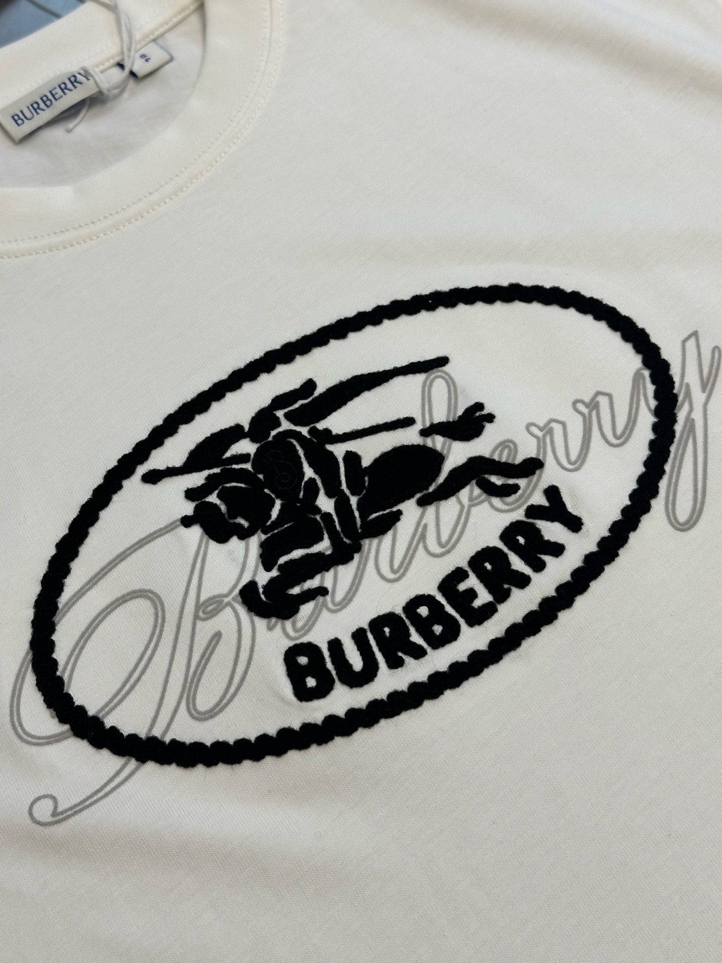 White T-shirt with large black oval Burberry graphic print