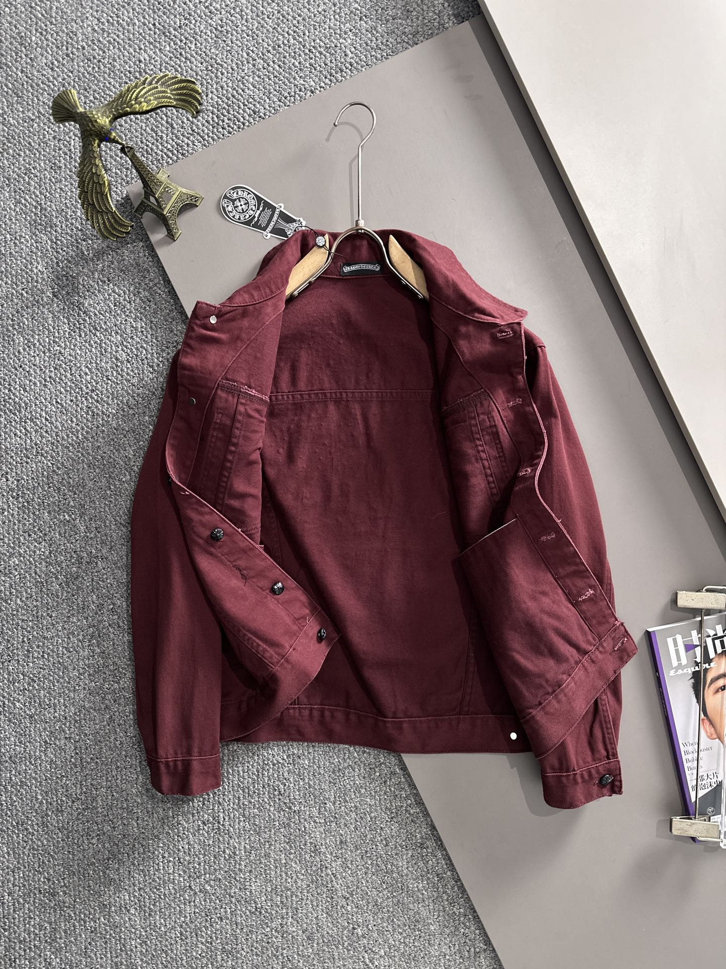 Maroon long-sleeve denim jacket front on hanger, point collar, snap buttons, stud accents