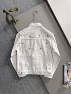 White denim jacket back view with black dot pattern, denim button front, on hanger