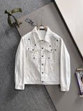 White denim jacket with black star-and-dot embroidery, button front, chest flap pockets