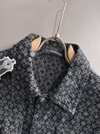 Patterned long-sleeve jacket on hanger, showing pointed collar and chest pockets