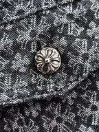 Close-up of jacket button on textured patterned fabric