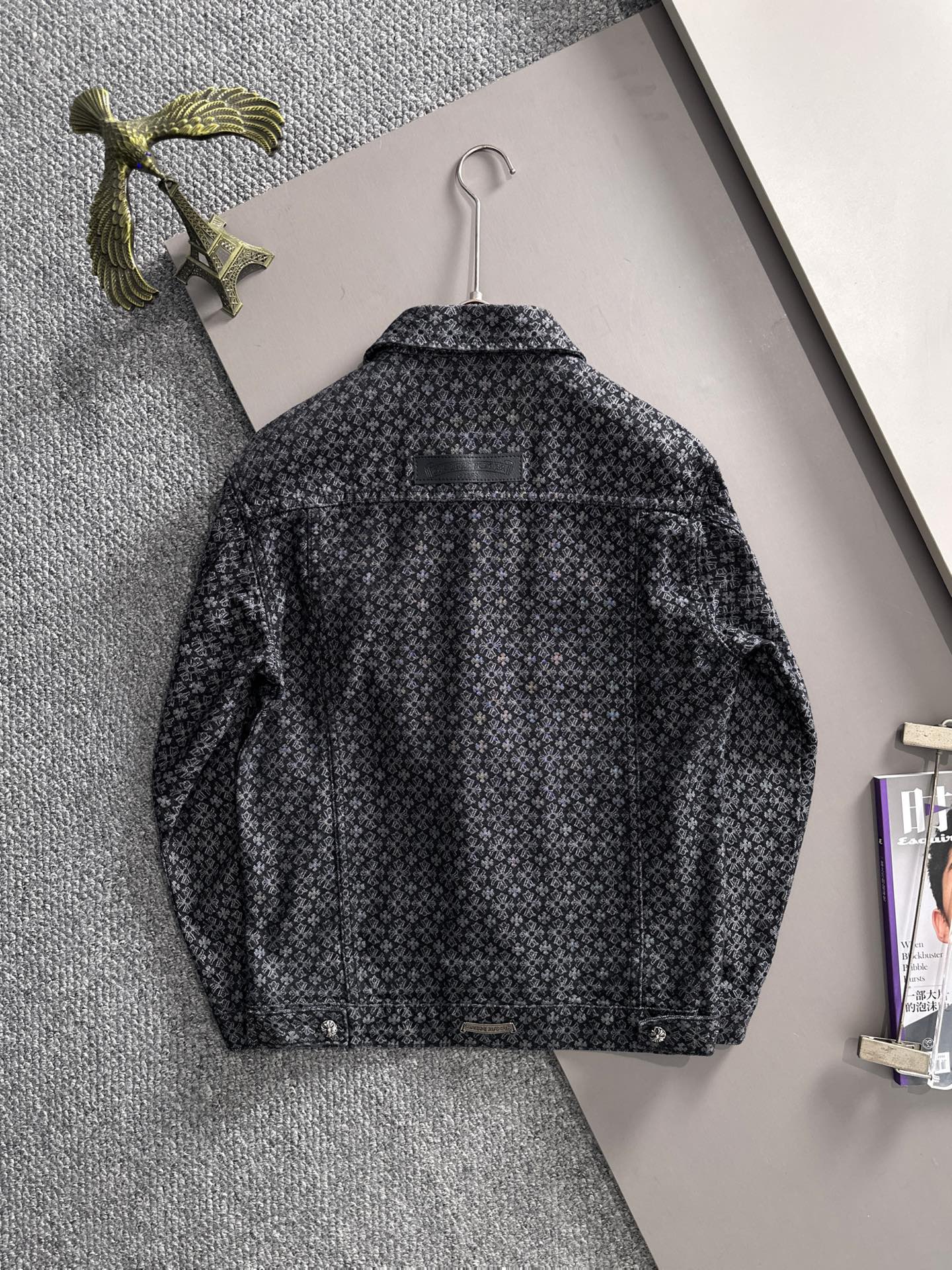 Patterned long-sleeve jacket back view on hanger with full buttoned style