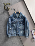 Blue denim jacket with embroidered patches and button front