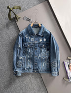 Blue denim jacket with embroidered patches and button front