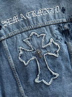 Blue denim jacket back with large cross-shaped embroidered graphic