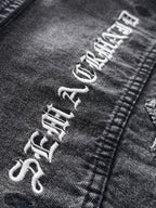Dark denim jacket graphic embroidery on sleeve cuff with distressed lettering
