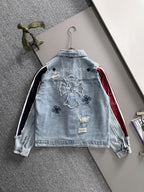 Light blue denim jacket back with embroidered motifs and navy-and-white stripe side panels