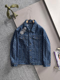 Blue long-sleeve denim jacket with allover pattern and button front, on hanger