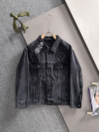 Dark denim jacket with pointed collar, front pockets, and studded chest patches