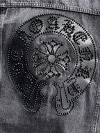 Large ornate studded back patch close-up with circular design on dark denim